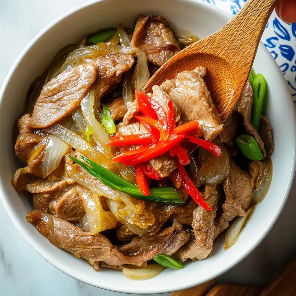 Gyudon Japanese Beef Rice Bowl, Japanese beef bowl recipe, easy Gyudon recipe, homemade Gyudon, quick Japanese comfort food A white bowl filled with thin slices of cooked brown meat layered with translucent cooked onions and bits of green onion. On top, there are small strips of bright red pickled vegetable adding a pop of color. A wooden spoon is scooping some of the meat and onions, held by a woman's hand, while another woman's hand holds the bowl on the left. The bowl is placed on a white marbled surface with a partially visible white lid with blue and beige patterns on the right side.