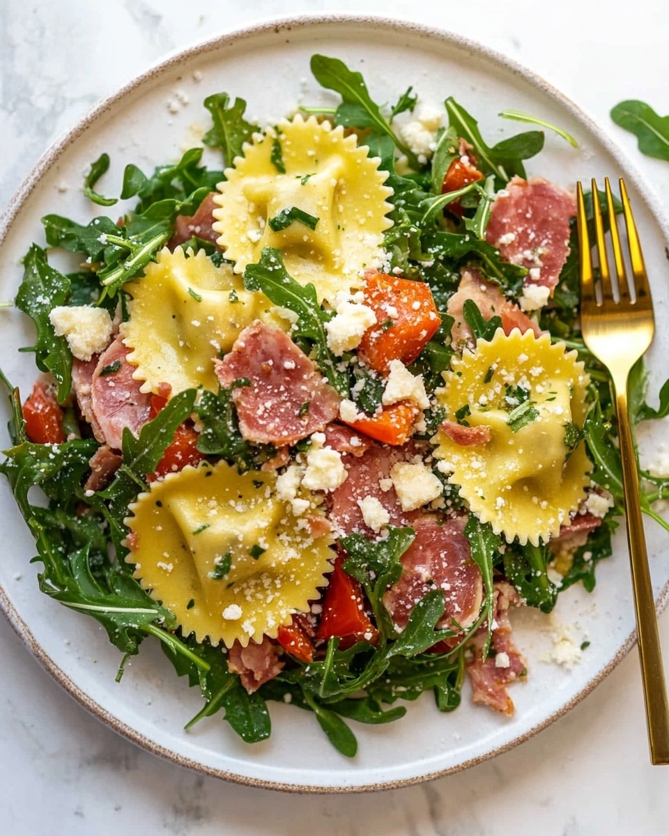 On a white plate, there is a layer of green arugula leaves scattered around. On top of this, there are large, yellow ravioli pieces with crinkled edges, mixed with chunks of reddish roasted peppers and small pieces of pinkish meat. The dish is sprinkled with white crumbled cheese and black pepper, giving it a textured and colorful look. The plate is set on a white marbled surface with a beige and white cloth nearby. Photo taken with an iphone --ar 4:5 --v 6.1