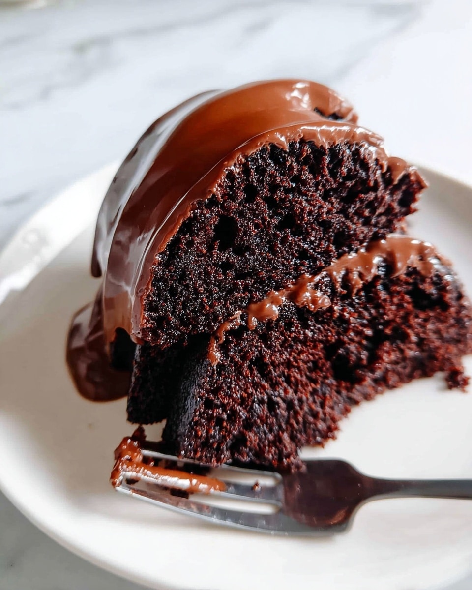 Two thick layers of dark chocolate cake with a moist texture are stacked on a white plate. Between the layers and on top, there is a smooth, shiny chocolate glaze that looks rich and creamy, slightly dripping over the edges. The cake slice is held by a fork on a white marbled surface in the background. Photo taken with an iphone --ar 4:5 --v 7