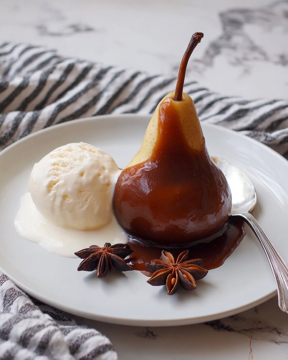 A single whole pear stands upright on a white plate with a light striped pattern, covered halfway by thick, shiny dark chocolate sauce that drips down to form a small pool around its base. To the left of the pear is a scoop of white ice cream melting slightly onto the plate. Two star anise pods lie to the right side of the pear, and a silver spoon rests in the background on the plate. The scene is set on a white marbled surface with a white cloth featuring black stripes nearby. Photo taken with an iphone --ar 4:5 --v 7