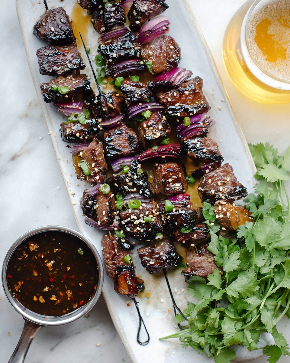 Three metal skewers lie on a long white plate, each filled with layers of dark brown grilled meat cubes and pieces of purple onion, glazed with a shiny sauce that has sesame seeds sprinkled on it. Bright green chopped herbs and small green onion slices are scattered across the top of the skewers and plate. Around the plate, there are some green herbs and chopped green onions in a gray bowl, all set on a white marbled surface. The scene looks fresh and inviting, with a close-up focus on the rich colors and textures of the grilled food photo taken with an iphone --ar 4:5 --v 7
