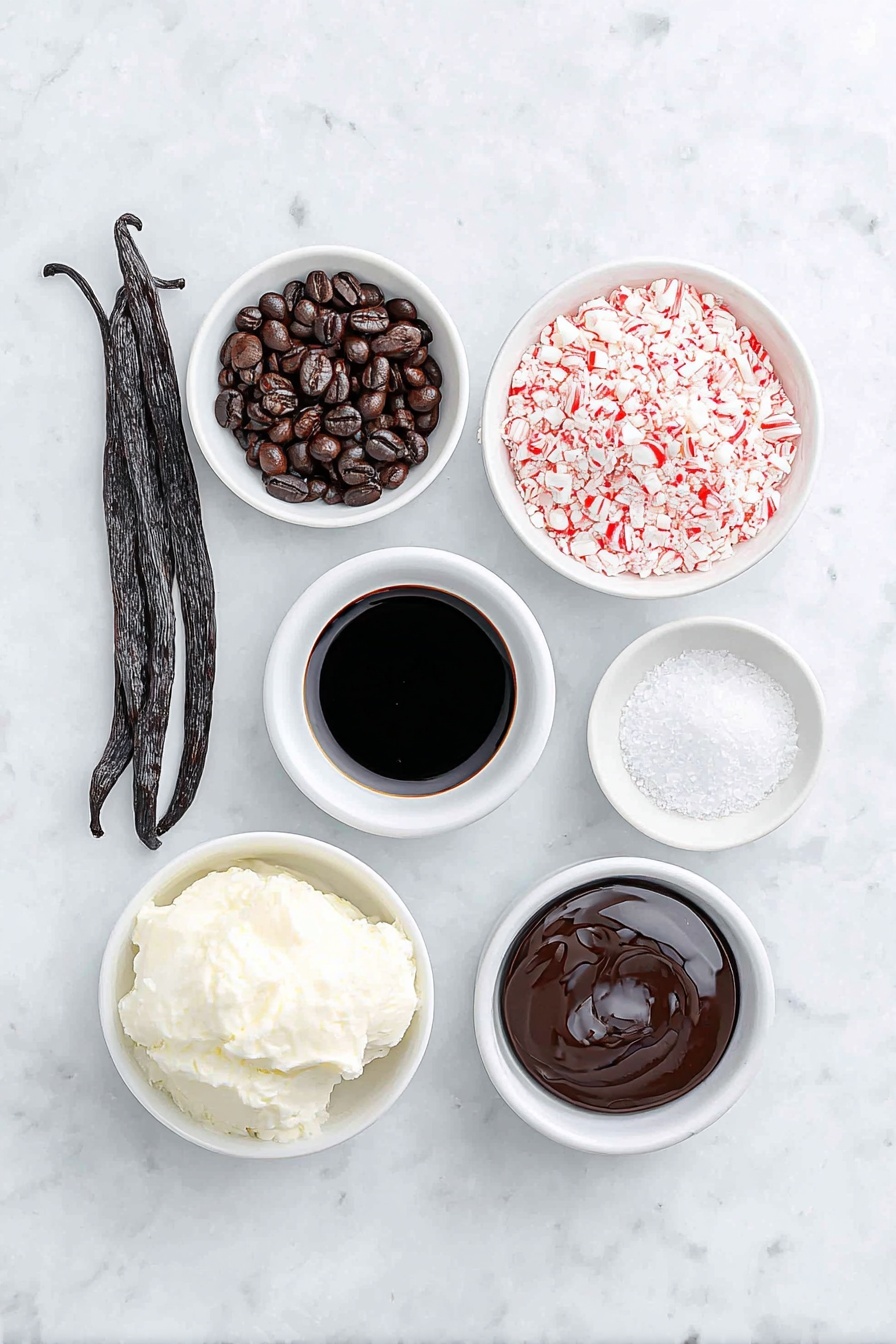 Flat lay of fresh whole vanilla bean pod, two glossy dark roasted espresso beans, a small white ceramic bowl of rich black espresso, a small white ceramic bowl with creamy half & half, a small white ceramic bowl of smooth dark coffee liqueur, a small white ceramic bowl of clear peppermint extract, a small white ceramic bowl filled with crushed red and white candy cane pieces, and a small white ceramic bowl of glossy chocolate syrup, all arranged in perfect symmetry, placed on a clean white marble surface, soft natural light, photo taken with an iPhone, professional food photography style, fresh ingredients, white ceramic bowls, no bottles, no duplicates, no utensils, no packaging --ar 2:3 --v 7 --p m7354615311229779997 - Peppermint Espresso Martini, festive cocktail, holiday martini, peppermint drink, coffee cocktail