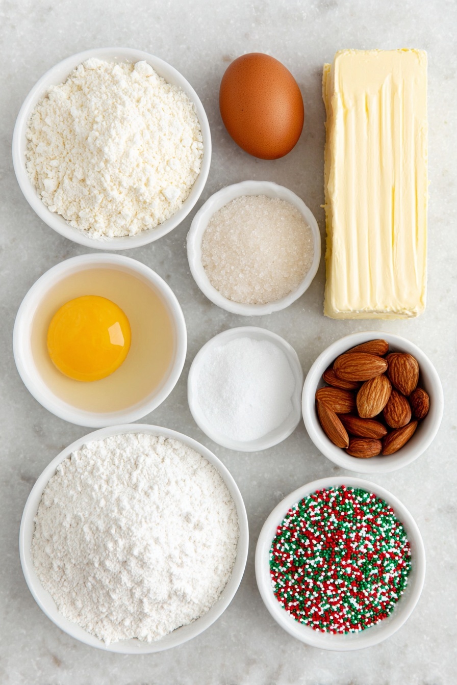 Flat lay of a stick of unsalted butter, a small heap of granulated sugar, one whole brown egg, a few almonds next to a small white bowl of clear almond extract, a small white bowl of pale vanilla extract, a mound of all-purpose flour, a small white bowl containing white cornstarch powder, a small white bowl filled with baking powder, a small white bowl of fine salt, a small white bowl filled with festive red and green nonpareil sprinkles, and three rectangles of cookie dough colored natural white, bright red, and vibrant green, all arranged in perfect symmetry on a clean white marble surface, soft natural light, photo taken with an iPhone, professional food photography style, fresh ingredients, white ceramic bowls, no bottles, no duplicates, no utensils, no packaging --ar 2:3 --v 7 --p m7354615311229779997 - Swirled Christmas Cookies, festive holiday cookies, Christmas cookie recipes, colorful holiday cookies, easy Christmas treats