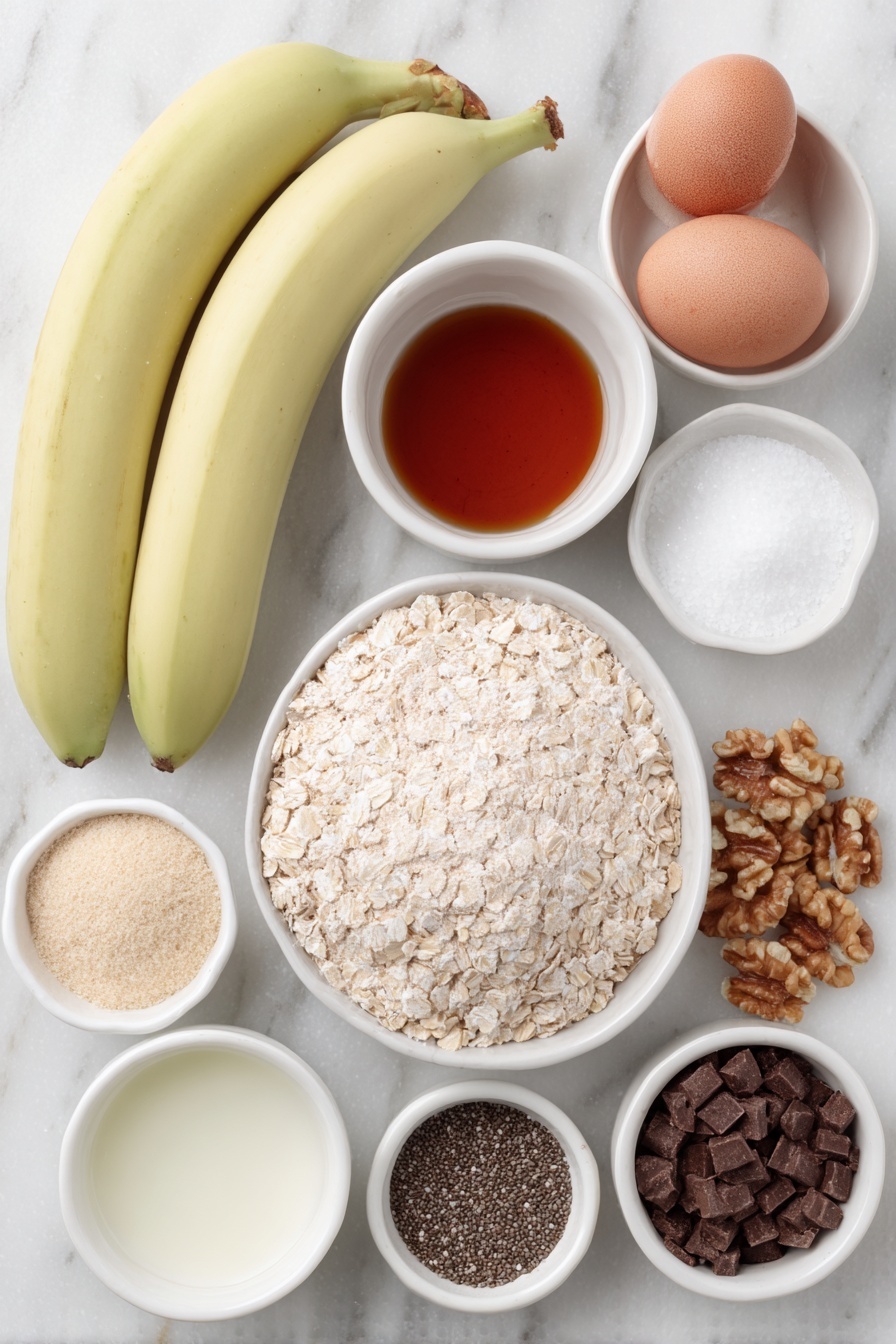 Flat lay of two large extra ripe bananas, a small heap of natural peanut butter, a small white bowl of pure maple syrup, one whole large egg with a clean shell, a small white bowl of pure vanilla extract, a small mound of oat flour, a small pile of golden flaxseed meal, a tiny sprinkle of ground cinnamon, a pinch of baking soda powder, a pinch of kosher salt, a small pile of old fashioned rolled oats, a few tablespoons of hemp hearts, a small spoonful of chia seeds, a small pile of semi-sweet chocolate chips, a small handful of chopped walnuts, and a few flakes of flaky sea salt, all arranged symmetrically around and inside simple white ceramic bowls, placed on a clean white marble surface, soft natural light, photo taken with an iPhone, professional food photography style, fresh ingredients, white ceramic bowls, no bottles, no duplicates, no utensils, no packaging --ar 2:3 --v 7 --p m7354615311229779997 - Healthy Banana Breakfast Cookies, Banana Breakfast Cookies, Healthy Morning Cookies, Nutritious Breakfast Snacks, Easy Healthy Cookies