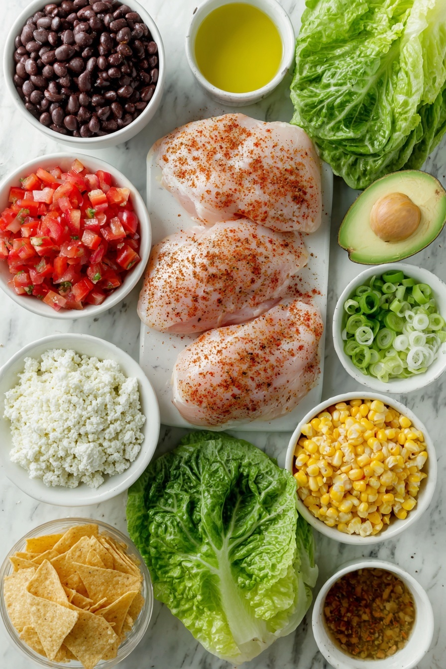 Flat lay of fresh boneless skinless chicken breasts seasoned with a mix of garlic powder, onion powder, smoked paprika, black pepper, salt, and chipotle powder in a small white ceramic bowl, a small white bowl of golden olive oil, vibrant green romaine lettuce leaves, a small white bowl of cooked black beans, a small white bowl of thawed bright yellow corn kernels, a whole shiny red bell pepper, a small white bowl filled with chopped ripe red tomatoes, a fresh green jalapeño pepper, two fresh green onions with white bulbs, a small white bowl holding crumbled white cotija cheese, a small white bowl with cooked fluffy quinoa, a perfectly ripe halved avocado showing its green flesh and pit, a small white bowl with broken golden tortilla chips, and a small white bowl containing chipotle honey vinaigrette ingredients: freshly squeezed lime juice, light olive oil, chopped chipotle peppers in adobo, chopped cilantro leaves, dried oregano powder, salt, a whole garlic clove, a drizzle of honey, water, and white vinegar — all arranged with perfect symmetry and balanced proportions in simple white ceramic bowls without packaging or utensils, placed on a clean white marble surface, soft natural light, photo taken with an iPhone, professional food photography style, fresh ingredients, white ceramic bowls, no bottles, no duplicates, no utensils, no packaging --ar 2:3 --v 7 --p m7354615311229779997 - Santa Fe Chicken Salad with Chipotle Vinaigrette, spicy chicken salad, healthy Mexican-inspired salad, quick summer chicken salad, bold flavor chicken salad