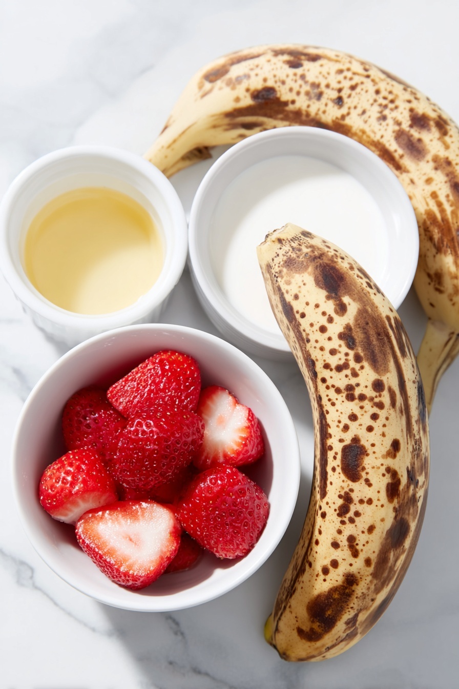 Flat lay of peeled ripe bananas with brown spots, bright red frozen strawberries, a small white ceramic bowl of pale vanilla extract, a small white ceramic bowl of creamy non-dairy milk, placed on a clean white marble surface, soft natural light, photo taken with an iPhone, professional food photography style, fresh ingredients, white ceramic bowls, no bottles, no duplicates, no utensils, no packaging --ar 2:3 --v 7 --p m7354615311229779997 - Strawberry Banana Smoothie Bowl, healthy smoothie bowl recipes, easy breakfast ideas, fruit smoothie bowl, quick nutritious snacks