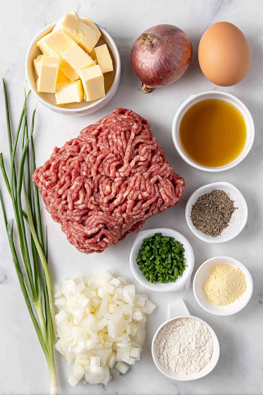 Flat lay of fresh ground beef formed into a smooth mound, a small mound of golden breadcrumbs, a whole brown egg with clean shell, a whole shallot with smooth purple skin, two diced shallots in a neat pile, two garlic cloves with fresh papery skins, a few bright green chopped chives, a small white ceramic bowl of golden olive oil, a small white ceramic bowl of pale yellow unsalted butter cubes, a small white ceramic bowl of smooth yellow mustard, a small white ceramic bowl of fine all-purpose flour, a small white ceramic bowl of clear amber whiskey, a small white ceramic bowl of rich brown beef broth, a small white ceramic bowl of creamy white cooking cream, a small pile of coarsely ground black pepper and a small pile of fine salt crystals — all arranged with perfect symmetry on a clean white marble surface, soft natural light, photo taken with an iPhone, professional food photography style, fresh ingredients, white ceramic bowls, no bottles, no duplicates, no utensils, no packaging --ar 2:3 --v 7 --p m7354615311229779997 - Creamy Whiskey Hamburger Steaks, whiskey hamburger steak recipe, hearty hamburger steak with whiskey sauce, easy whiskey beef skillet, comforting hamburger steak dinner